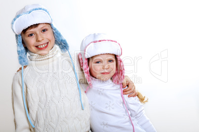 Kid in winter wear against white background