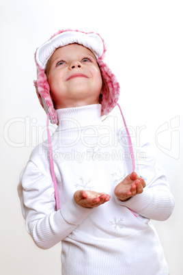 Kid in winter wear against white background