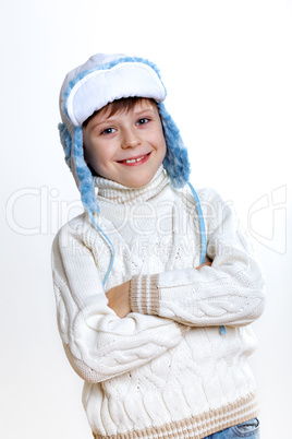 Kid in winter wear against white background