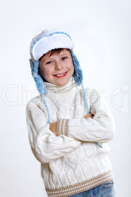 Kid in winter wear against white background