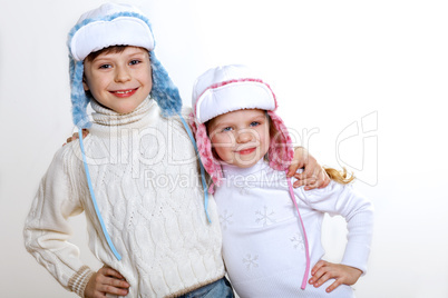 Kid in winter wear against white background