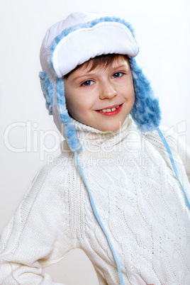 Kid in winter wear against white background