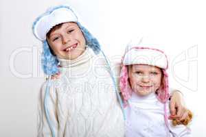 Kid in winter wear against white background