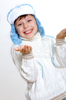 Kid in winter wear against white background