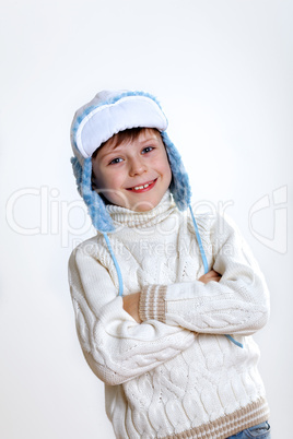 Kid in winter wear against white background