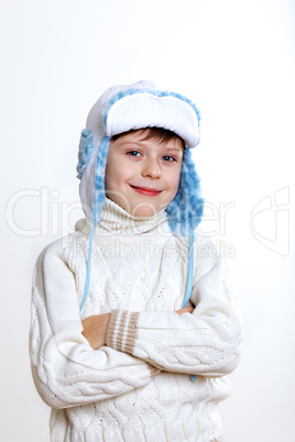 Kid in winter wear against white background