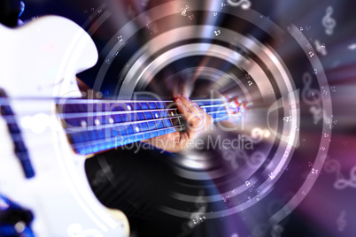 Young guitar player performing in night club