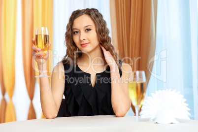 Young pretty woman sitting in restaurant