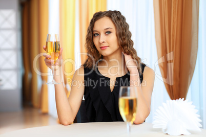 Young pretty woman sitting in restaurant