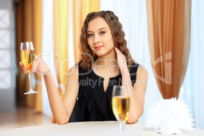 Young pretty woman sitting in restaurant