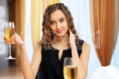 Young pretty woman sitting in restaurant