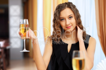 Young pretty woman sitting in restaurant