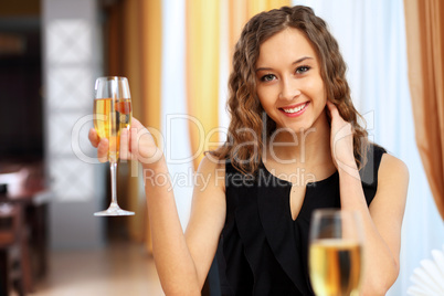 Young pretty woman sitting in restaurant