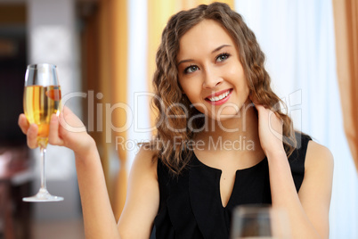 Young pretty woman sitting in restaurant