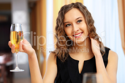 Young pretty woman sitting in restaurant