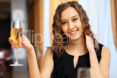 Young pretty woman sitting in restaurant