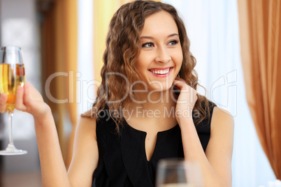 Young pretty woman sitting in restaurant