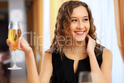 Young pretty woman sitting in restaurant