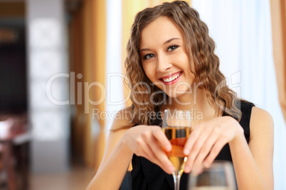 Young pretty woman sitting in restaurant