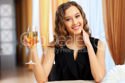 Young pretty woman sitting in restaurant