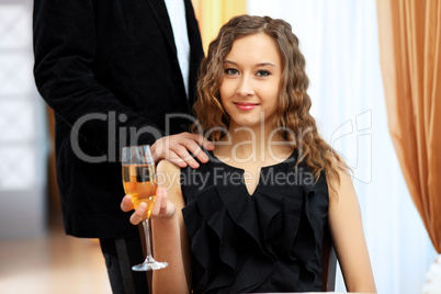 Young pretty woman sitting in restaurant