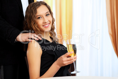 Young pretty woman sitting in restaurant