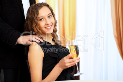 Young pretty woman sitting in restaurant