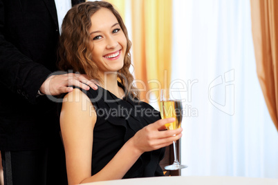 Young pretty woman sitting in restaurant