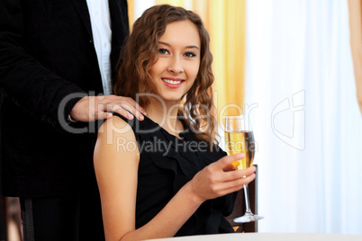 Young pretty woman sitting in restaurant