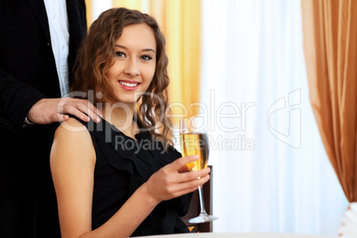 Young pretty woman sitting in restaurant