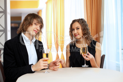 Couple in a restaurant with shampagne