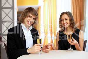 Couple in a restaurant with shampagne