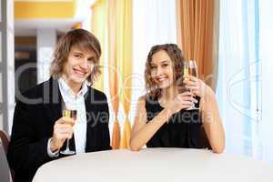 Couple in a restaurant with shampagne