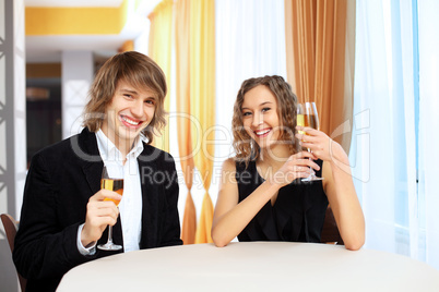 Couple in a restaurant with shampagne