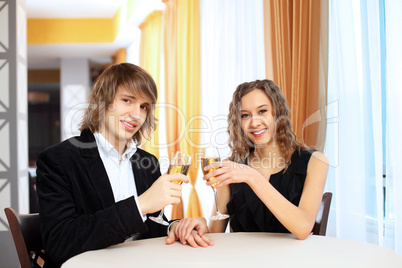 Couple in a restaurant with shampagne