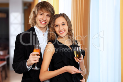 Couple in a restaurant with shampagne