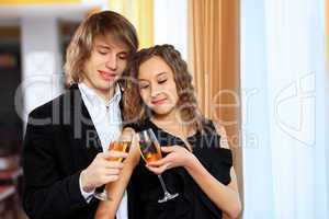 Couple in a restaurant with shampagne