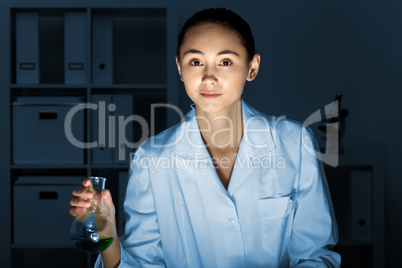 Young chemist working in laboratory