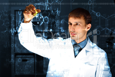 Young chemist working in laboratory