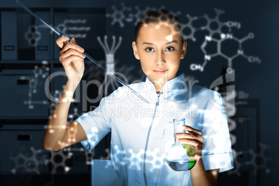 Young chemist working in laboratory