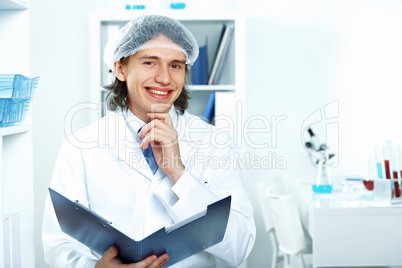 Young doctor in white uniform