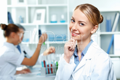 Young scientists working in laboratory Young scientists working in laboratory
