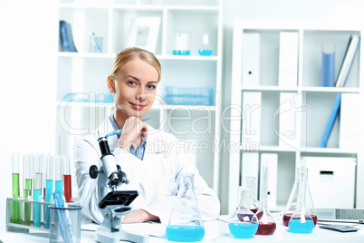 Young scientist working in laboratory Young scientist working in laboratory