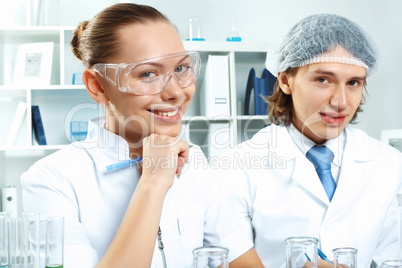 Young scientists working in laboratory Young scientists working in laboratory
