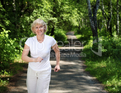 Elderly woman likes to run in the park