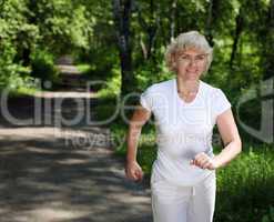 Elderly woman likes to run in the park