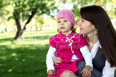 Mother with her daughter in summer park