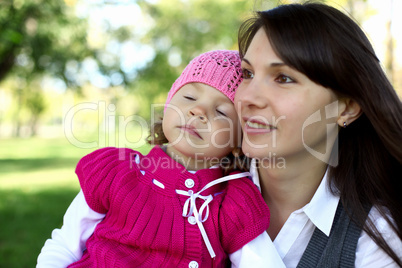 Mother with her daughter in summer park