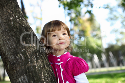 Little girl in summer park