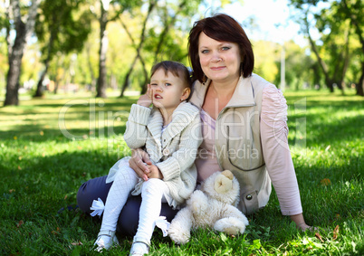 Grandmother with her little granddaghter in park